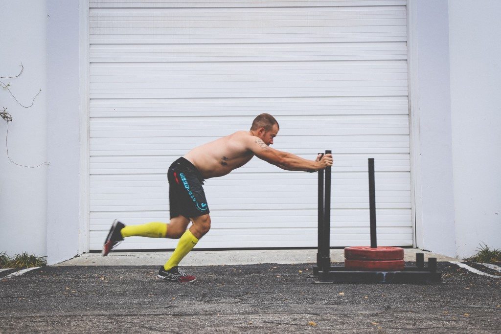 yellow running compression socks used during crossfit
