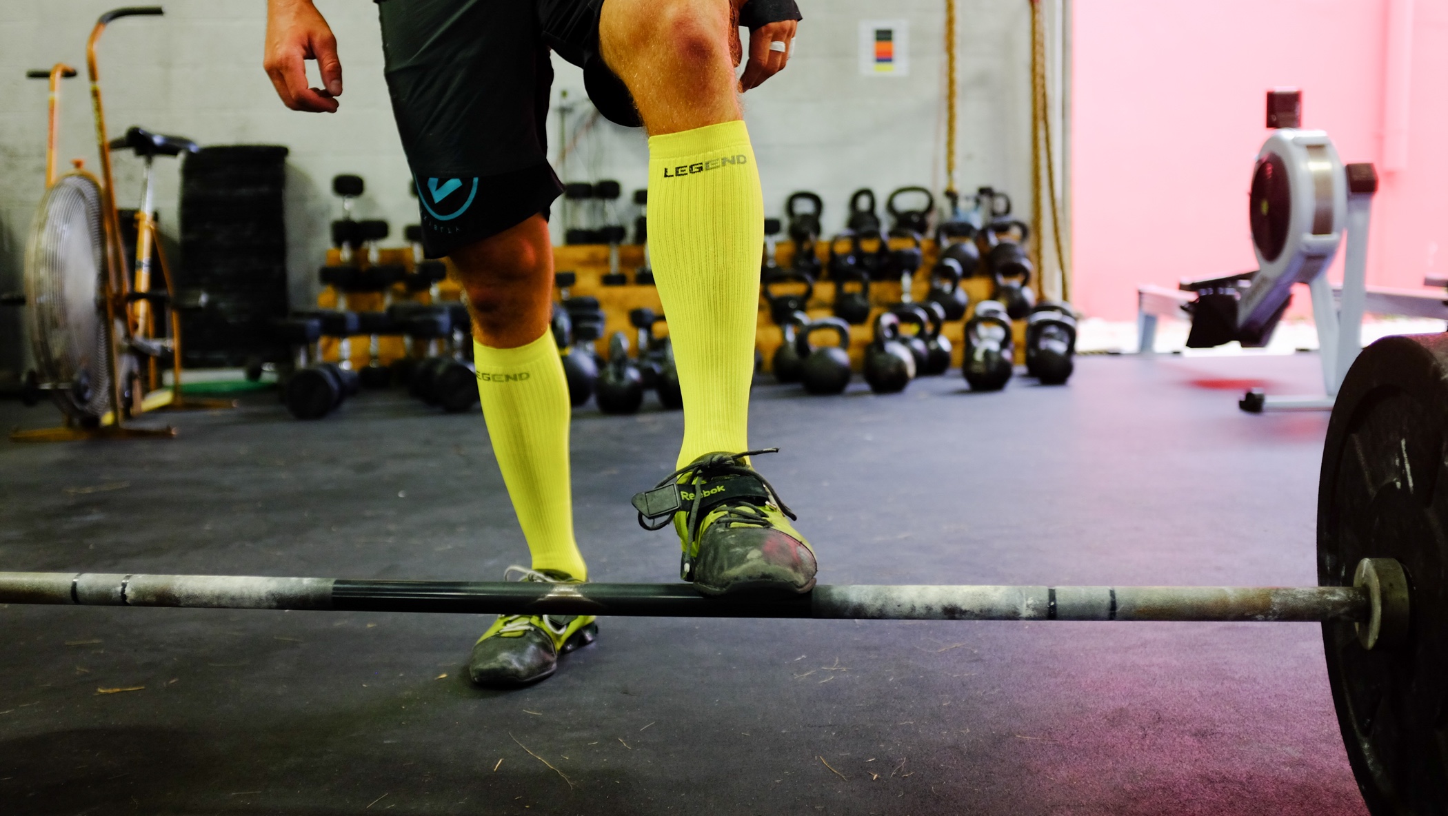 LEGEND athlete with yellow compression socks