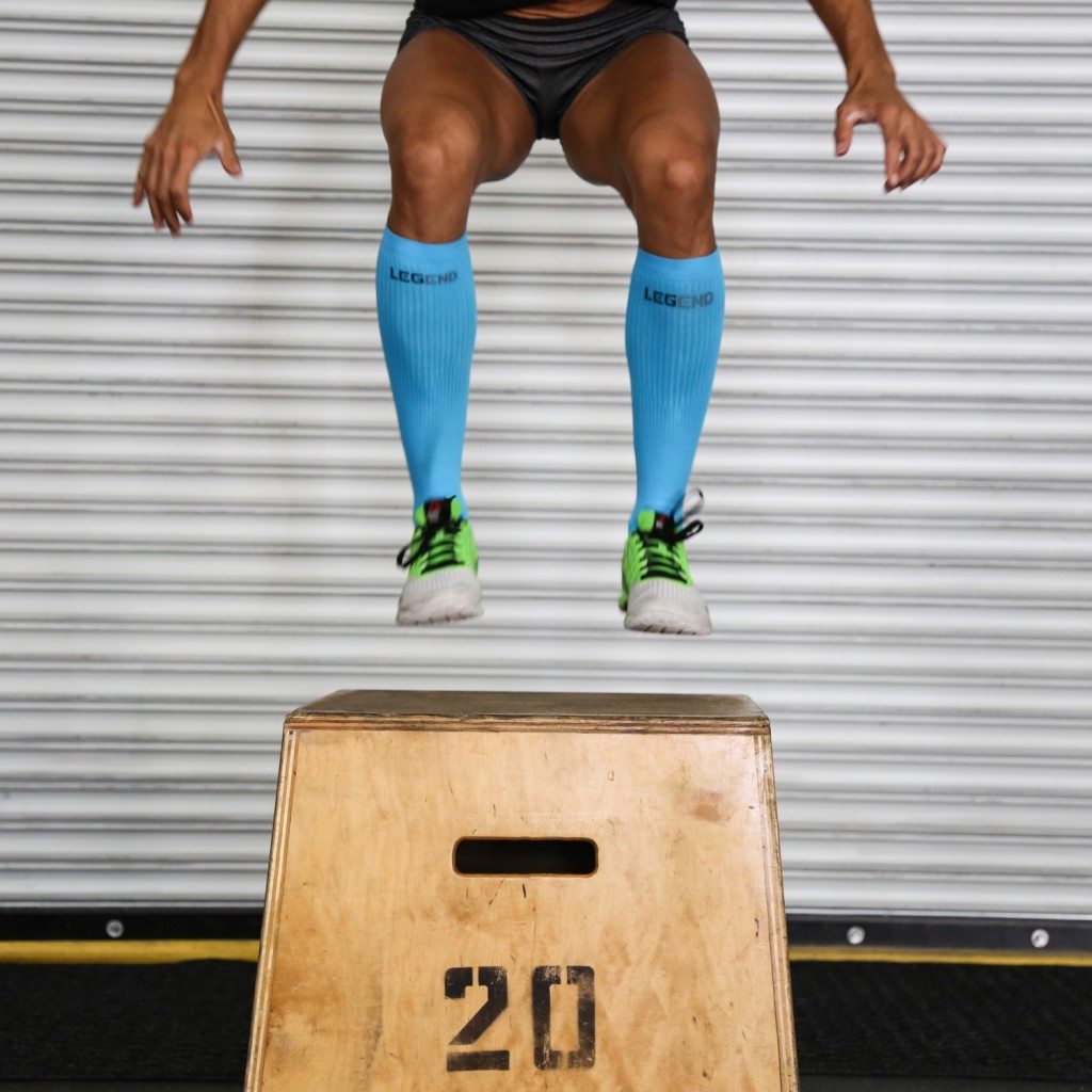 woman jumping in compression socks